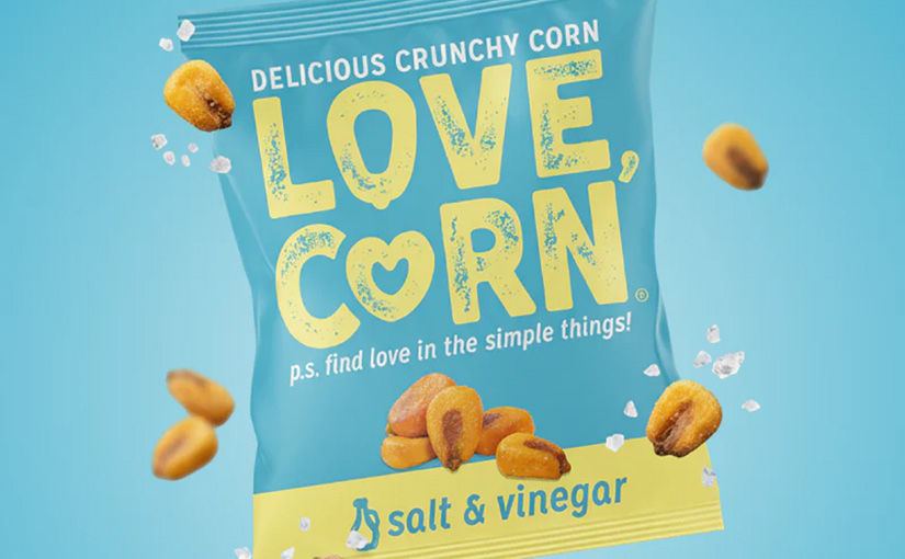 A packet of salt and vinegar love corn against a blue background