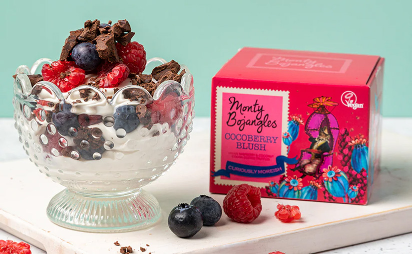 A box of Monty Bojangles cocoberry crush next to a bowl of yoghurt and fruit